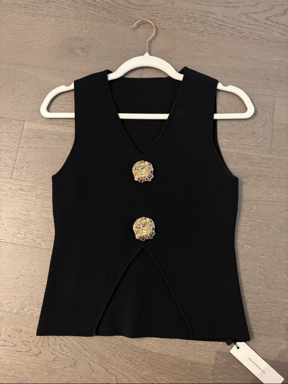 Black Sleeveless V-Neck Top with Decorative Gold Buttons